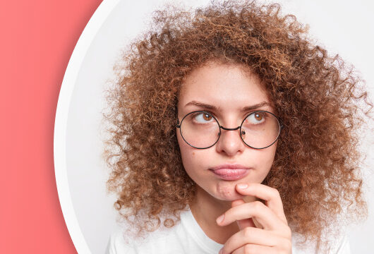 Photo of woman thinking with red color block to the left