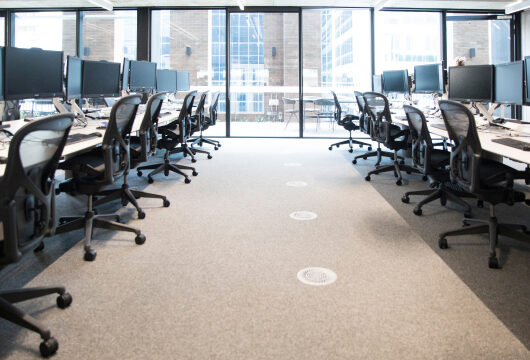 Empty office space with rows of office chairs