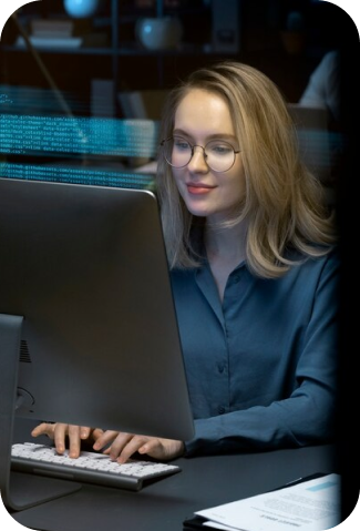 woman behind laptop coding