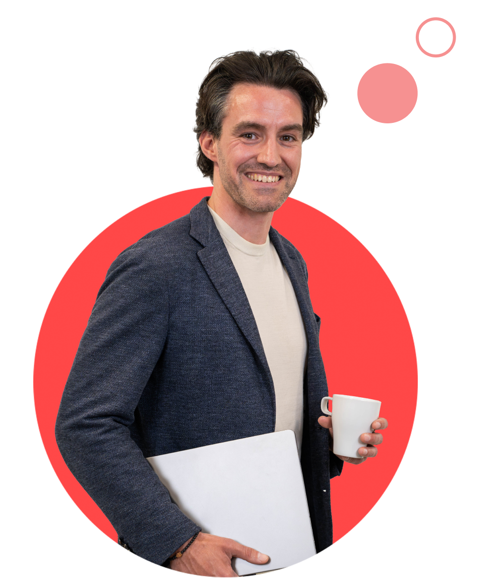 Colleague holding a laptop and coffeemug in his hands in red circle