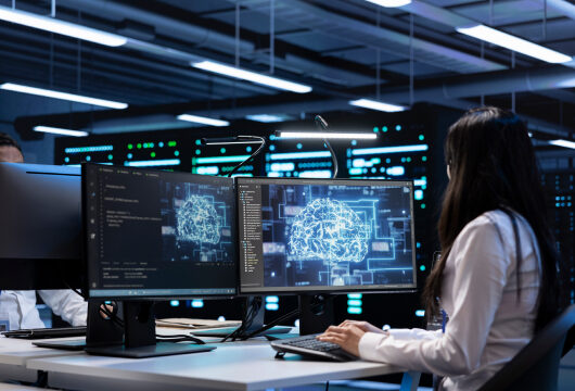 Feature image for GenAI Roi blog. Image of woman looking at computer screen.