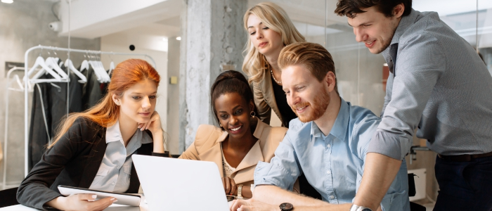 banner image for ServiceNow governance blog. Visual of 5 people looking at a laptop screen. 3 women and 2 men of different ages and ethnicities