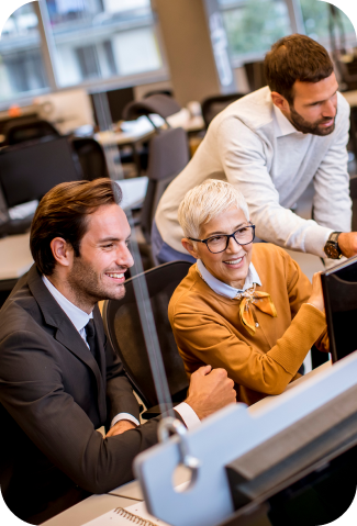 image of man and a woman in an office looking at a screen.